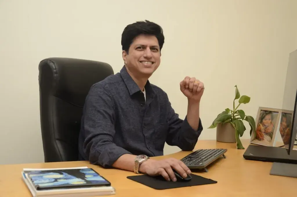 Binu Prakash, Founder and CEO of SANGAU, at his desk